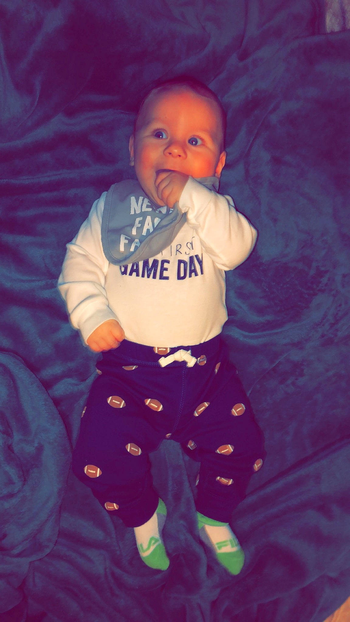 Justin Jr is registered to the contest to win money with this photo: baby, baby_toddler_clothing, elbow, eye, face, flash_photography, gesture, happy, head, human_body, organ, person, pink, purple, sleeve, t_shirt, textile, thigh, thumb, toddler