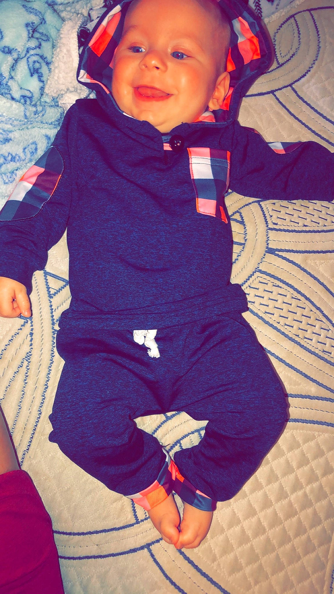 Justin Jr is registered to the contest to win money with this photo: baby, baby_products, baby_toddler_clothing, blue, child, comfort, electric_blue, happy, human_body, leg, magenta, outerwear, pattern, person, personal_protective_equipment, purple, red, sleeve, thigh, toddler