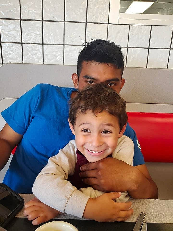 Ashton joined the competition — help win amazing prizes! arm, chair, child, comfort, couch, cup, event, fun, happy, joy, lap, leisure, muscle, person, recreation, room, sitting, smile, t_shirt, table