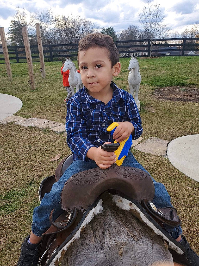 Ashton joined the competition — help win amazing prizes! child, city, cloud, face, fun, grass, happy, leisure, person, plant, public_space, recreation, reptile, sitting, sky, smile, soil, spring, t_shirt, toddler