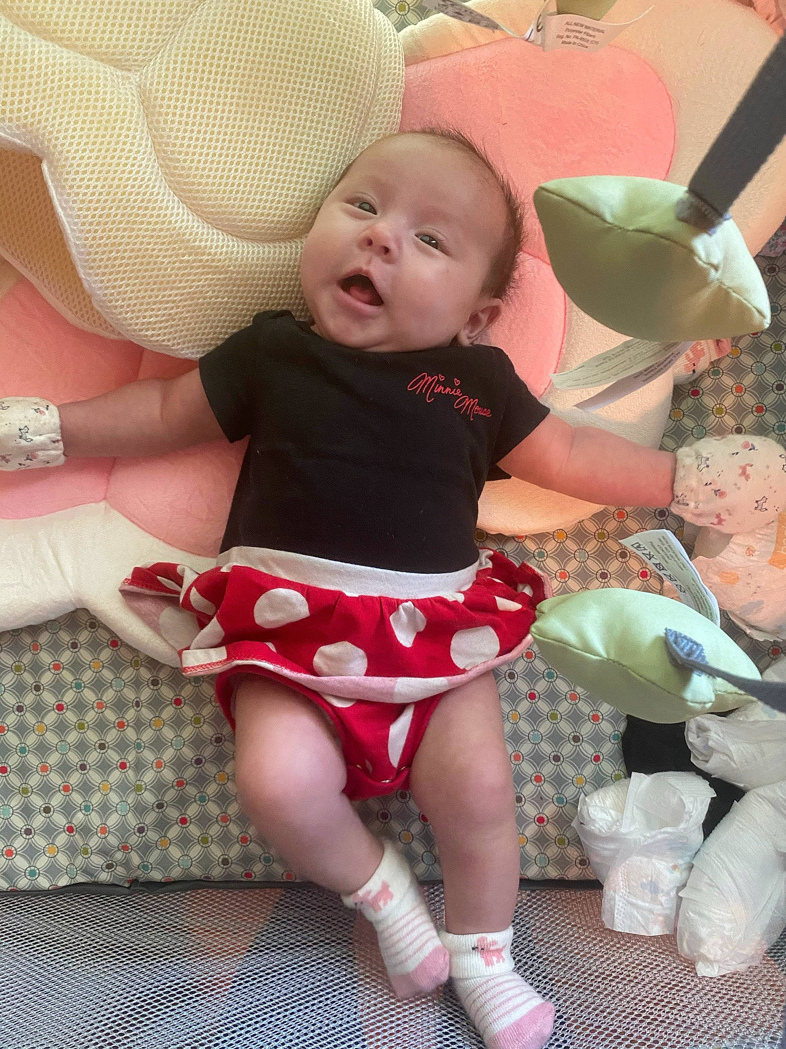 Rebekah is registered to the contest to win money with this photo: baby, baby_toddler_clothing, child, comfort, face, finger, fun, happy, head, human_body, human_leg, knee, lap, leg, person, pink, skin, sock, textile, thigh