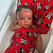 Mila is registered to the contest to win money with this photo: baby, bathtub, towel, red, mickey_mouse, minnie_mouse, water, child, bath, skin, face, expression, hand, relaxing, cute, infant, indoors, person, small, cute_expression