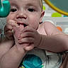 Bruce is registered to the contest to win money with this photo: baby, infant, foot, hand, mouth, face, eyes, skin, baby_seat, pattern, mirror, colorful, cute, child, toddler, grip, playful, indoors, portrait, closeup