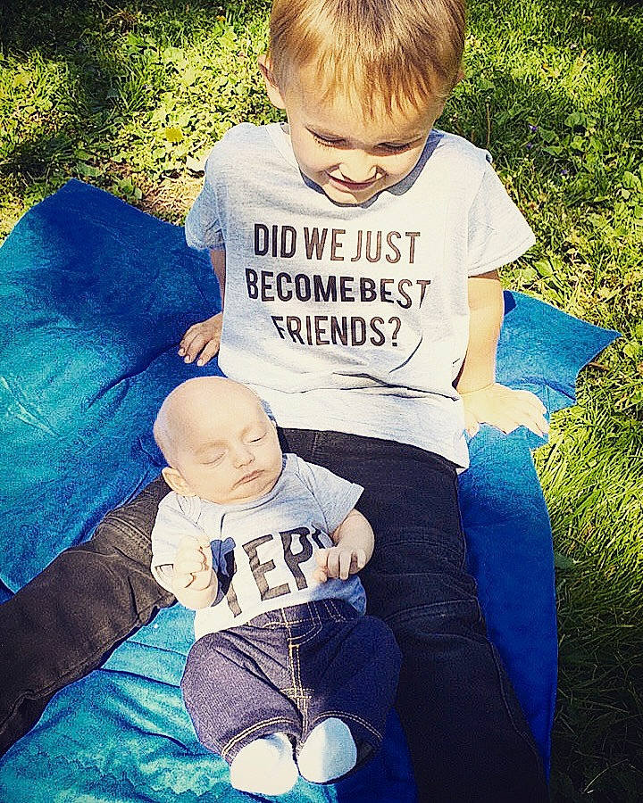 Dayton is registered to the contest to win money with this photo: baby, child, cool, family, fun, grass, male, people, person, photography, play, product, recreation, sibling, sitting, summer, t_shirt, toddler, top, tree