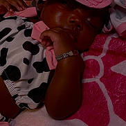 Ivori joined the competition — help win amazing prizes! baby, sleeping, infant, pink, bow, bracelet, blanket, cute, cozy, clothing, pattern, resting, soft, child, person, indoor, closeup, face, hand, accessory