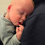 Thimoté participe au concours pour gagner de l'argent avec cette photo : baby, cheek, child, closeup, comfort, cozy, ear, face, fingers, hand, head, indoors, nap, peaceful, person, portrait, resting, skin, sleeping, soft_clothing