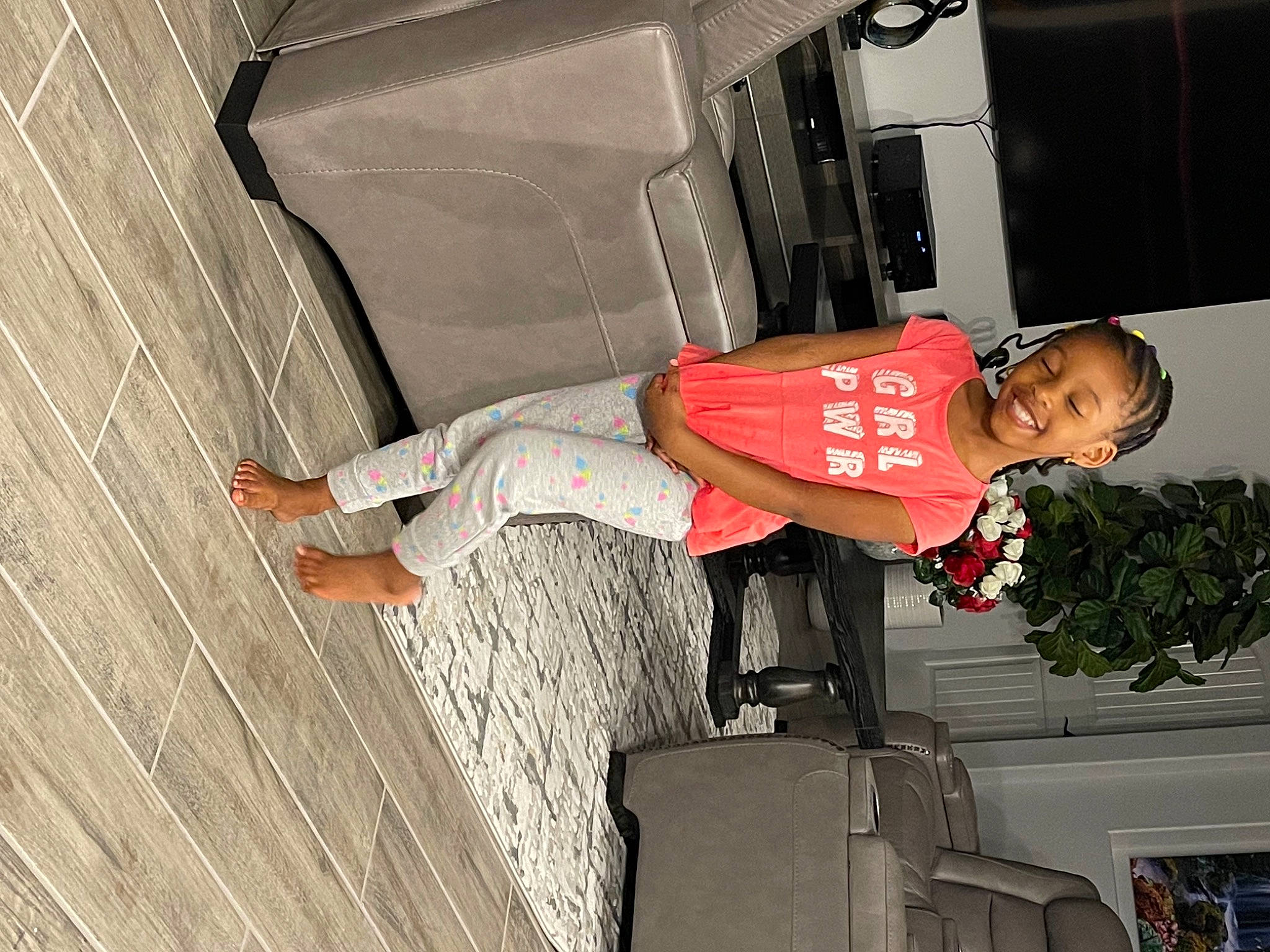 Jlynn is registered to the contest to win money with this photo: automotive_exterior, child, fun, joy, person, plant, street_fashion, tire, toddler, vehicle, walking_shoe, wood