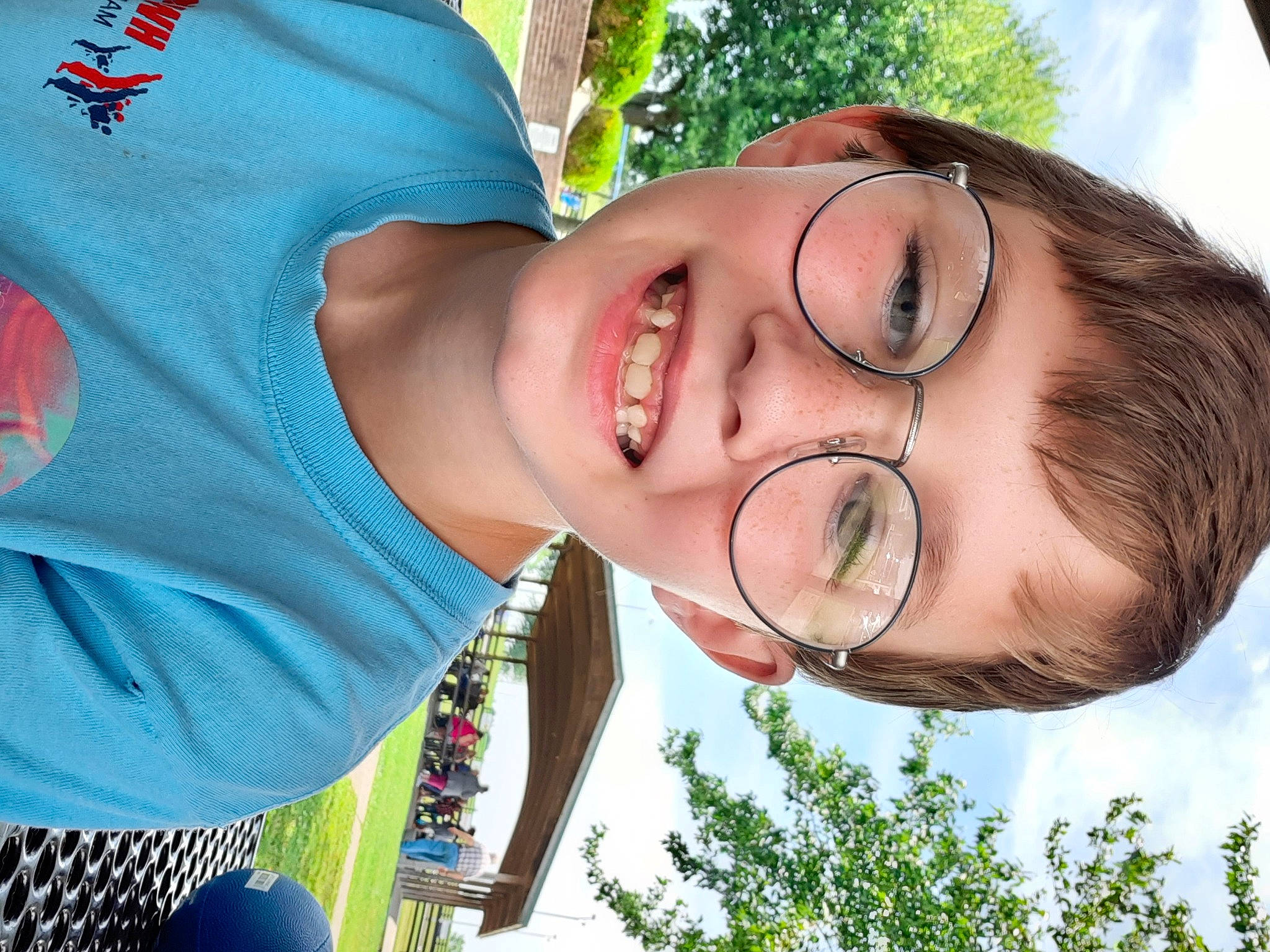 Eli joined the competition — help win amazing prizes! blue, cool, daytime, eyewear, glasses, grass, happy, jaw, joy, leisure, light, lip, mouth, neck, nose, people, people_in_nature, person, skin, smile