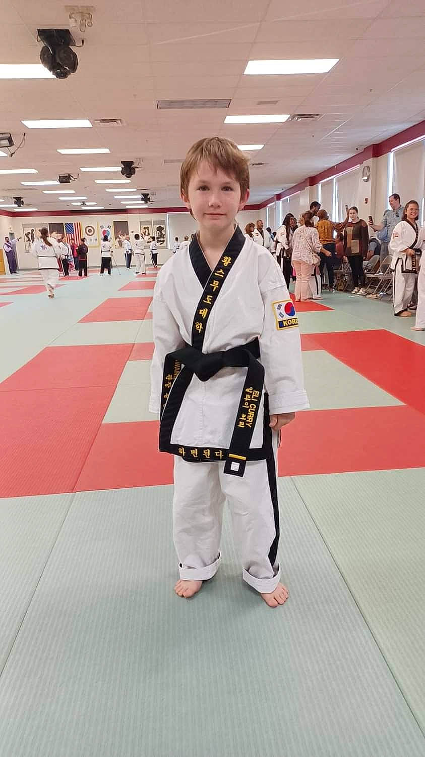 Eli is registered to the contest to win money with this photo: blurred, carpet, child, combat_sport, competition_event, contact_sport, costume, dobok, event, flooring, fun, individual_sports, japanese_martial_arts, joy, karate, martial_arts, martial_arts_uniform, person, recreation, sports_uniform