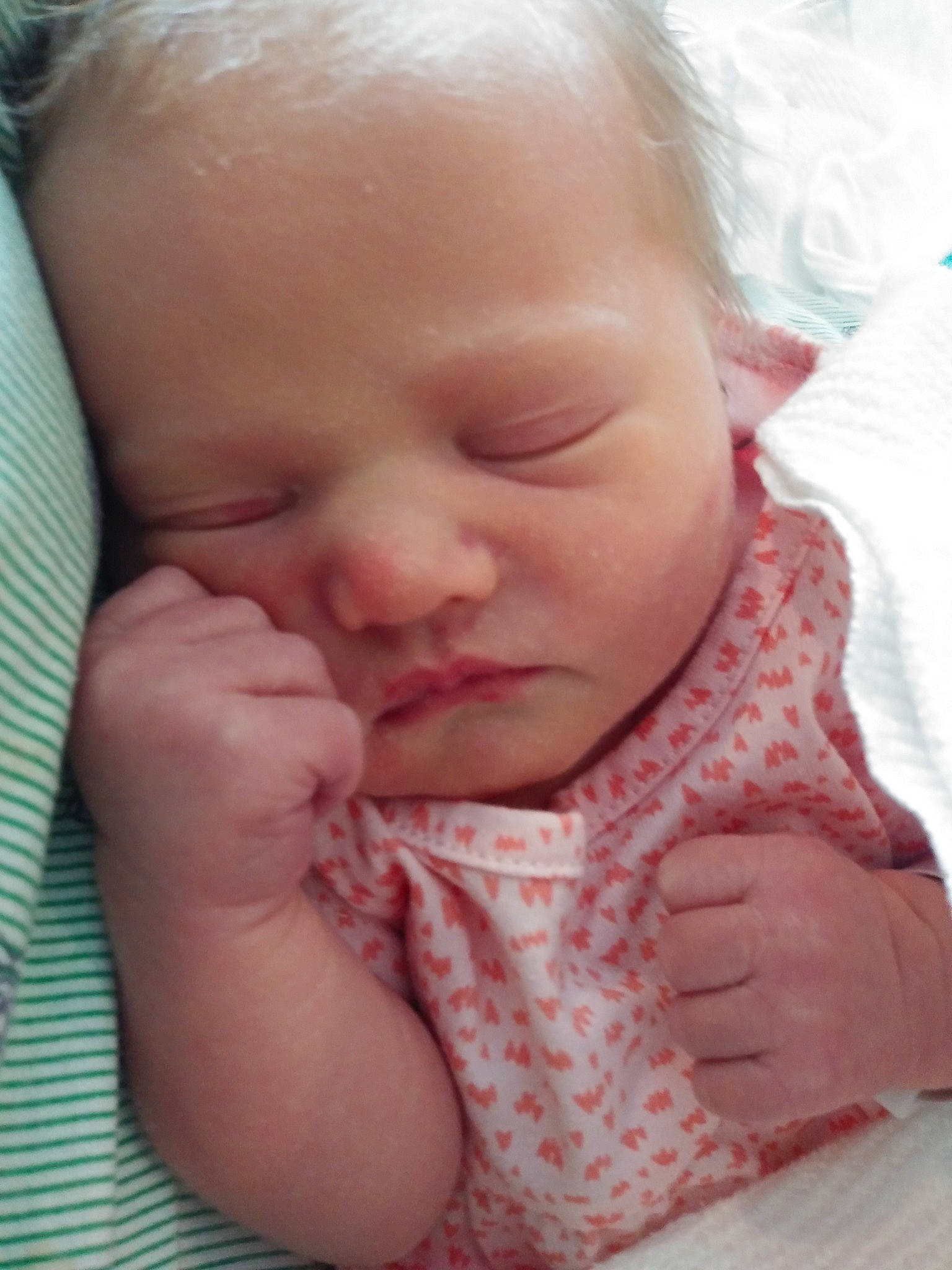 Isabelle is registered to the contest to win money with this photo: baby, cheek, child, chin, close_up, eye, face, facial_expression, finger, forehead, hand, head, lip, mouth, nose, person, pink, skin, sleep, smile