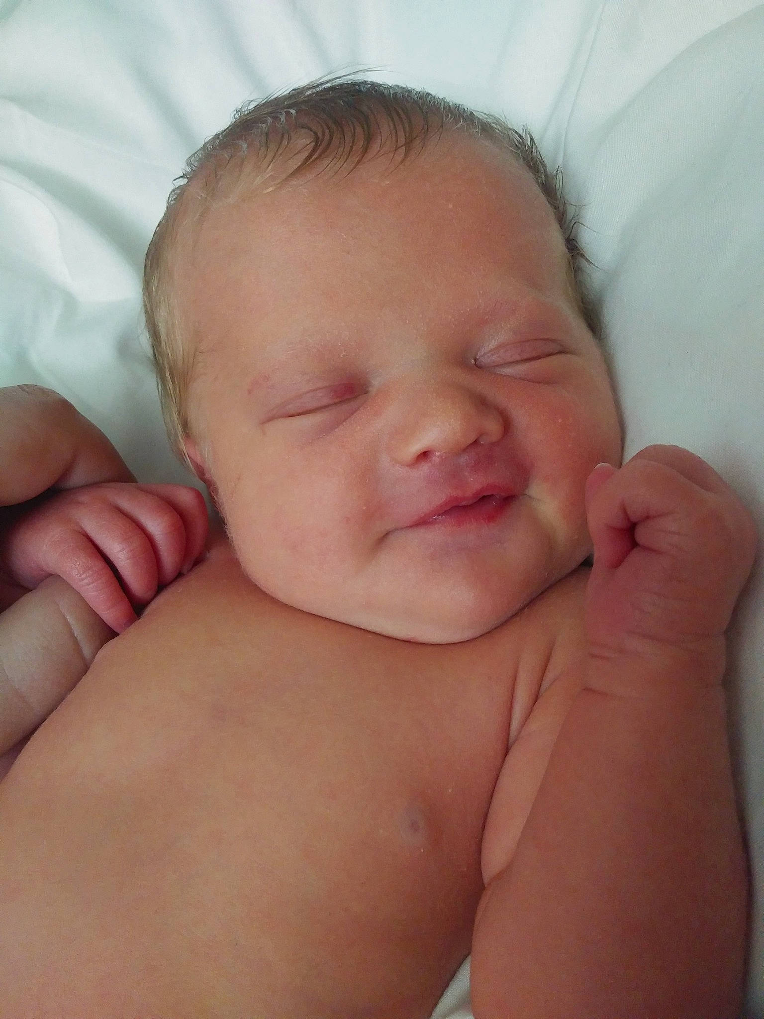 Isabelle is registered to the contest to win money with this photo: baby, baby_making_funny_faces, cheek, child, chin, close_up, eye, face, finger, forehead, hand, head, lip, mouth, muscle, nose, person, skin, sleep, stomach