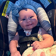 Oaklynn joined the competition — help win amazing prizes! baby, infant, car_seat, headband, bow, blanket, smile, happy, child, straps, clothing, cute, portrait, indoors, comfort, seat, person, skin, hand, face