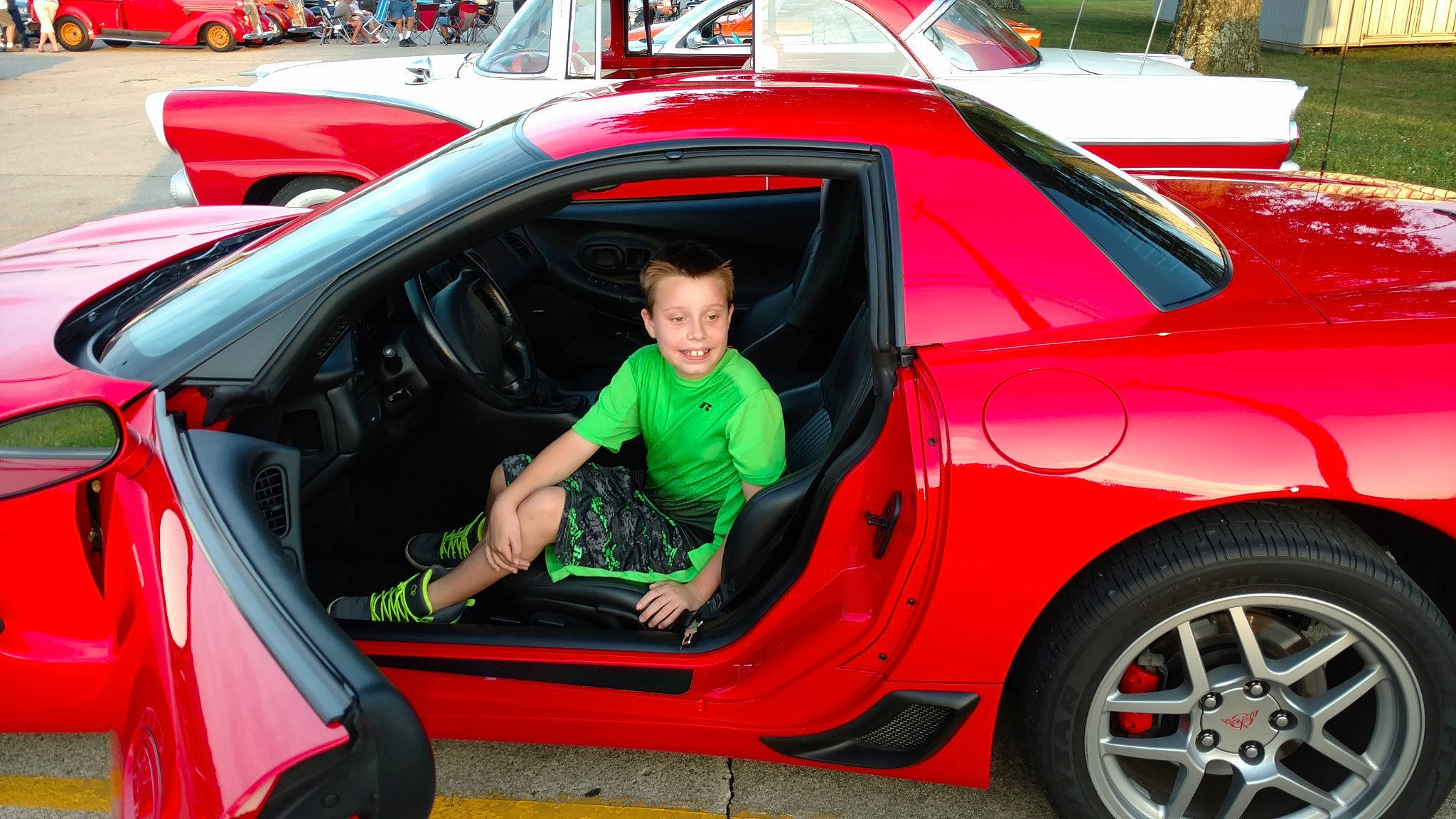 Nicholas is registered to the contest to win money with this photo: automotive_design, automotive_exterior, car, convertible, coupe, joy, land_vehicle, luxury_vehicle, motor_vehicle, muscle_car, performance_car, person, race_car, red, sports_car, supercar, vehicle