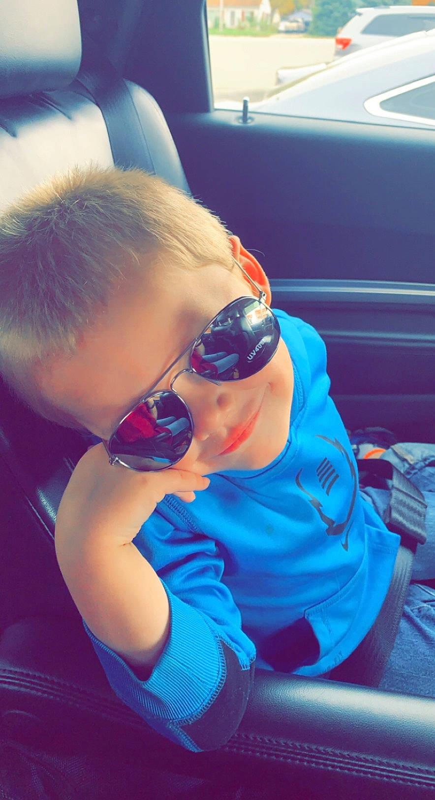 Jaxson joined the competition — help win amazing prizes! automotive_design, azure, blond, blue, child, cloud, cool, electric_blue, eyewear, fun, glasses, goggles, hairstyle, happy, person, personal_protective_equipment, sunglasses, thigh, toddler, vehicle_door
