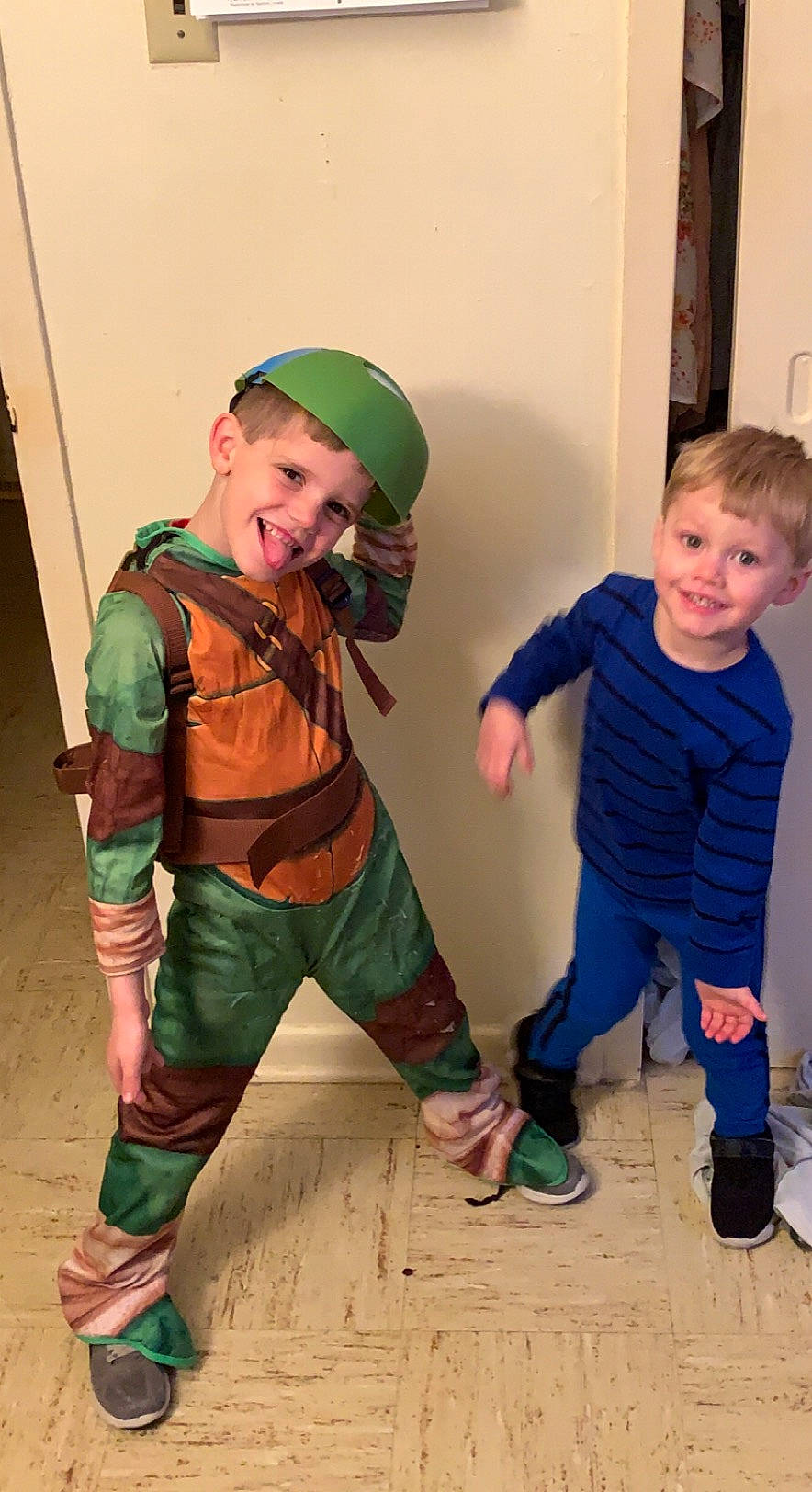 Jase is registered to the contest to win money with this photo: baby_toddler_clothing, boot, cap, child, costume, face, fictional_character, fun, joy, military_camouflage, pattern, person, personal_protective_equipment, play, room, shoe, sleeve, smile, sneakers, sock