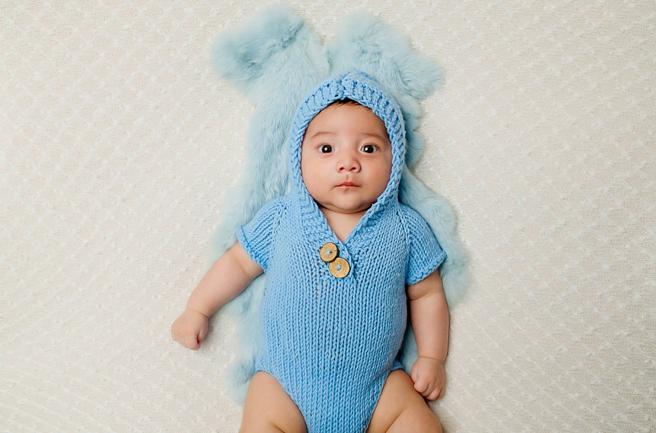 Emiliano participe au concours pour gagner de l'argent avec cette photo : aqua, art, azure, baby, baby_toddler_clothing, cap, cheek, clothing, craft, doll, electric_blue, eye, eyebrow, eyelash, hair_accessory, headwear, iris, lip, pattern, person