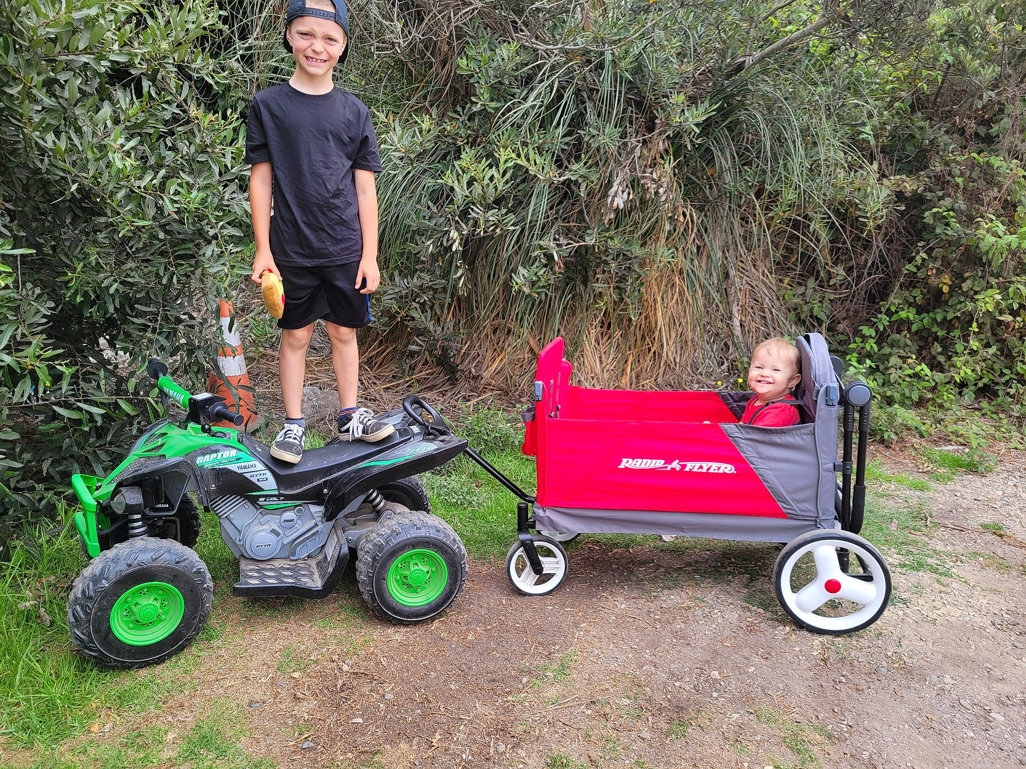 Corbyn is registered to the contest to win money with this photo: automotive_tire, automotive_wheel_system, cap, event, fun, grass, headwear, joy, lawn_mower, leisure, mode_of_transport, motor_vehicle, mower, person, plant, recreation, shorts, smile, tire, tractor