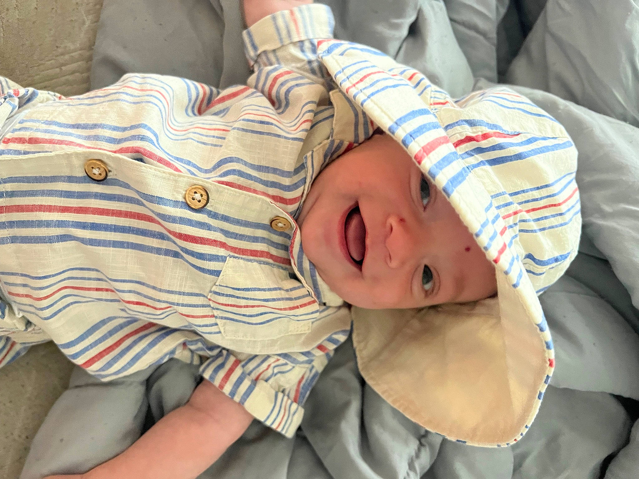 Mathew joined the competition — help win amazing prizes! baby, baby_toddler_clothing, child, comfort, elbow, fun, happy, hat, headwear, human_leg, linens, mammal, nail, pattern, person, sitting, sleeve, smile, toddler, vacation