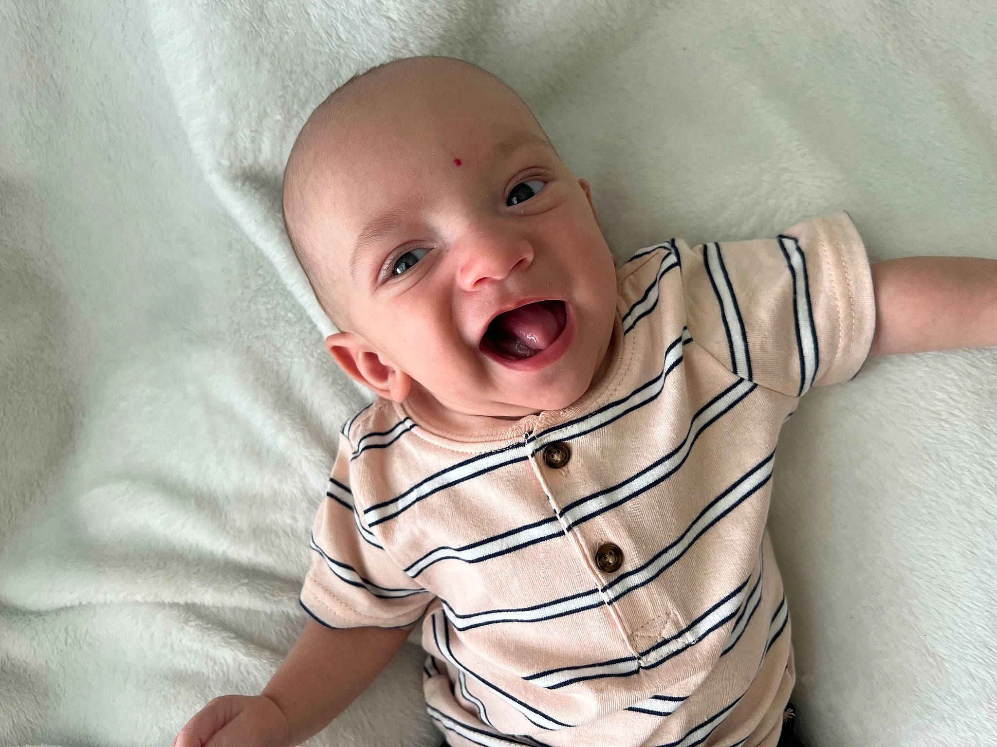 Mathew is registered to the contest to win money with this photo: baby, baby_laughing, baby_toddler_clothing, cheek, collar, comfort, eye, fun, gesture, happy, head, iris, linens, lip, nose, person, sleeve, smile, t_shirt, textile