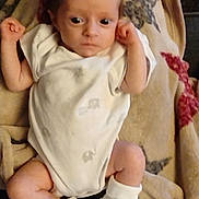 Oliver is registered to the contest to win money with this photo: baby, infant, onesie, blanket, booties, soft_fabric, star_pattern, lying_down, wide_eyes, clenched_fists, indoor, newborn, cute, small_feet, closeup, portrait, baby_clothes, resting, human, child