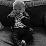 Nolan participe au concours pour gagner de l'argent avec cette photo : baby, black_and_white, child, couch, cushion, cute, hands, happy, indoor, infant, jacket, jeans, laughing, living_room, portrait, smiling, socks, sofa, tshirt, window