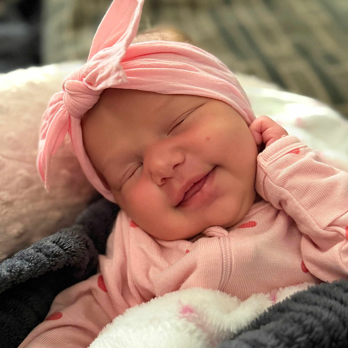 Scotlyn joined the competition — help win amazing prizes! baby, infant, smile, sleeping, headband, pink_clothing, blanket, cozy, cute, face, portrait, newborn, child, soft_lighting, indoors, relaxation, happy, sleep, hand, warm