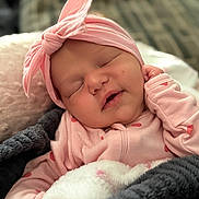 Scotlyn joined the competition — help win amazing prizes! baby, sleeping, pink_headband, pink_clothing, blanket, cozy, infant, cute, portrait, face, child, soft_texture, indoor, resting, newborn, hand, peaceful, closeup, adorable, toddler