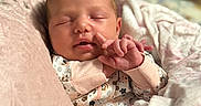 Scotlyn is registered to the contest to win money with this photo: baby, newborn, sleeping, blanket, onesie, infant, face, hand, cozy, soft, cute, peaceful, indoor, closeup, portrait, child, resting, comfort, warm, human