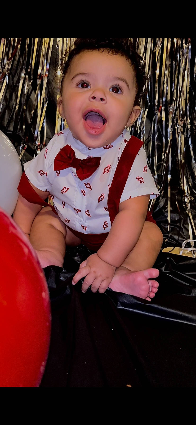 Raylan is registered to the contest to win money with this photo: baby, baby_toddler_clothing, balloon, child, event, fun, grass, happy, leisure, pattern, people, people_in_nature, person, pink, portrait_photography, product, recreation, sitting, smile, thigh