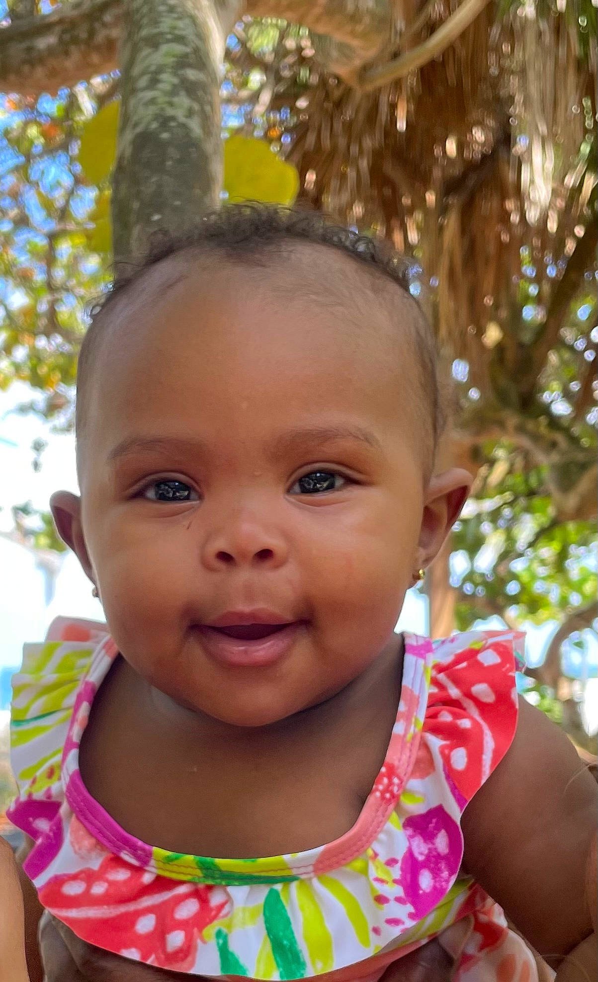 Aalaiyah is registered to the contest to win money with this photo: baby_toddler_clothing, cheek, chin, eye, eyebrow, grass, green, hair, hairstyle, happy, head, iris, lip, nose, people_in_nature, person, skin, smile, toddler, tree