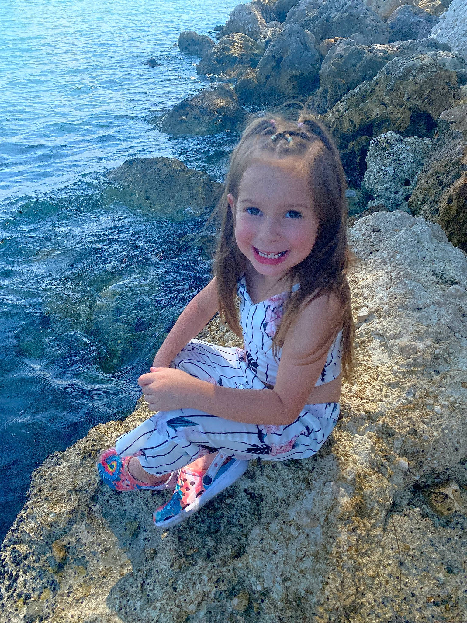 Abigale is registered to the contest to win money with this photo: azure, child, eye, facial_expression, flash_photography, fun, grass, happy, iris, joy, leisure, natural_environment, nature, people_in_nature, person, skin, smile, summer, sunlight, toddler