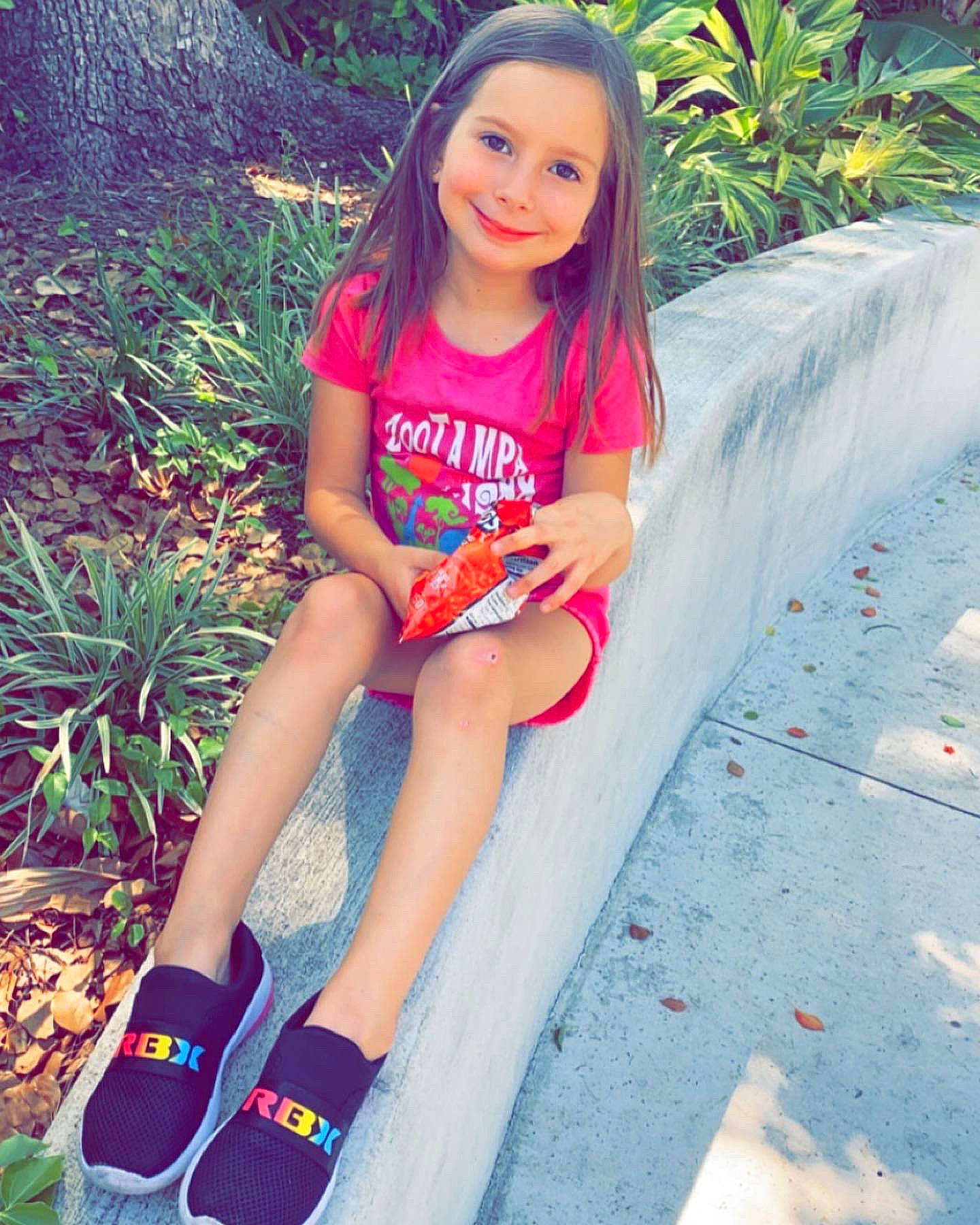 Abigale joined the competition — help win amazing prizes! cool, dress, eye, face, grass, hairstyle, happy, head, joy, leaf, leg, people_in_nature, person, pink, plant, shoe, shorts, sleeve, smile, textile