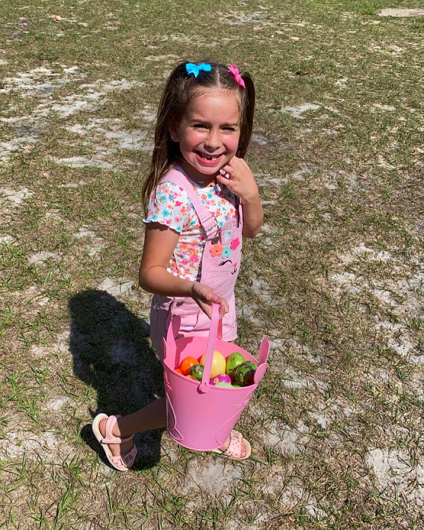 Abigale is registered to the contest to win money with this photo: baby_toddler_clothing, child, facial_expression, fun, goggles, grass, grass_family, hairstyle, happy, joy, leisure, magenta, people_in_nature, person, pink, recreation, shorts, smile, soil, summer