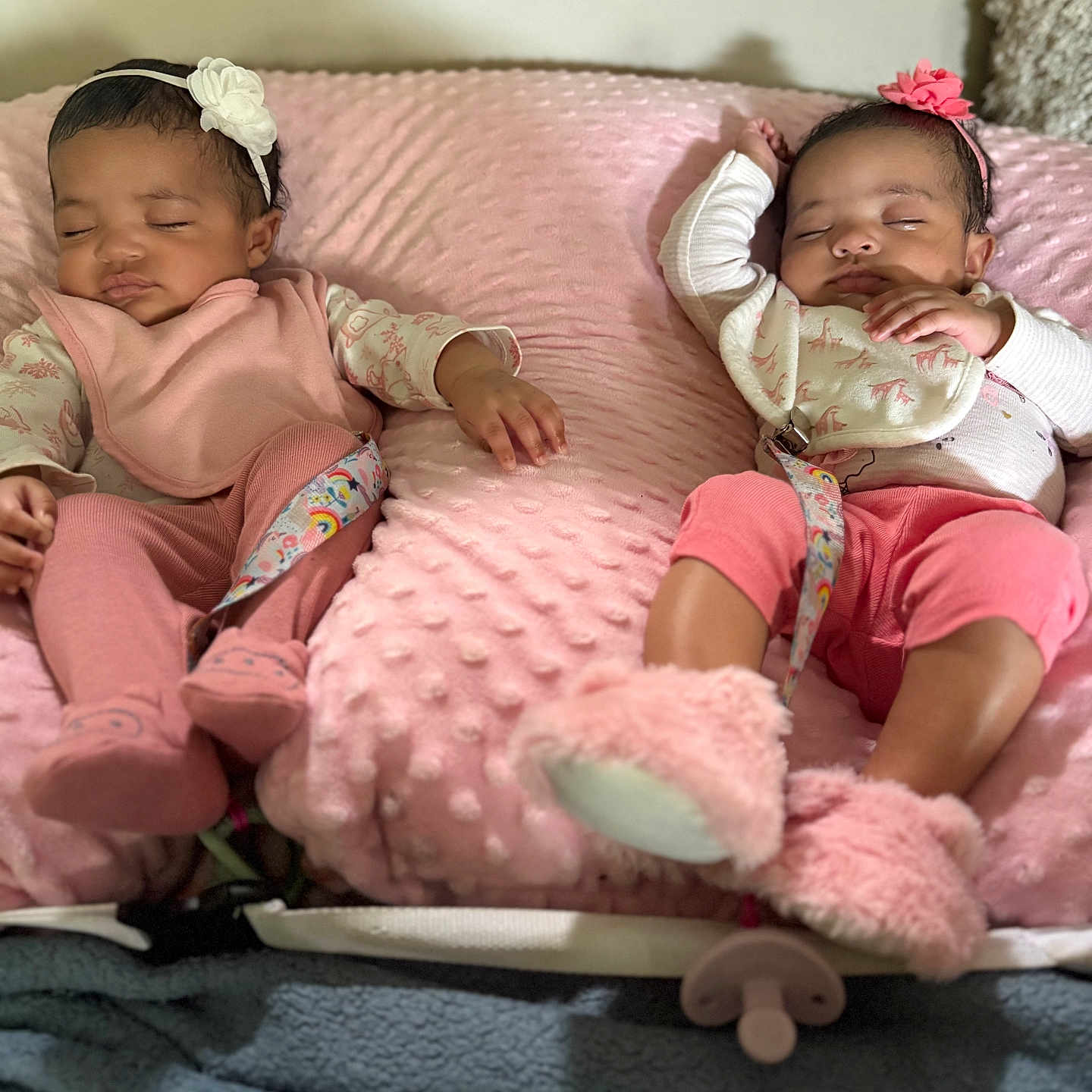 Sunnie And Summer is registered to the contest to win money with this photo: baby, blanket, clothing, comfort, cozy, cushion, cute, headband, indoors, infant, lying_down, nap, peaceful, pink, rest, sleeping, slippers, soft, toddler, two_children