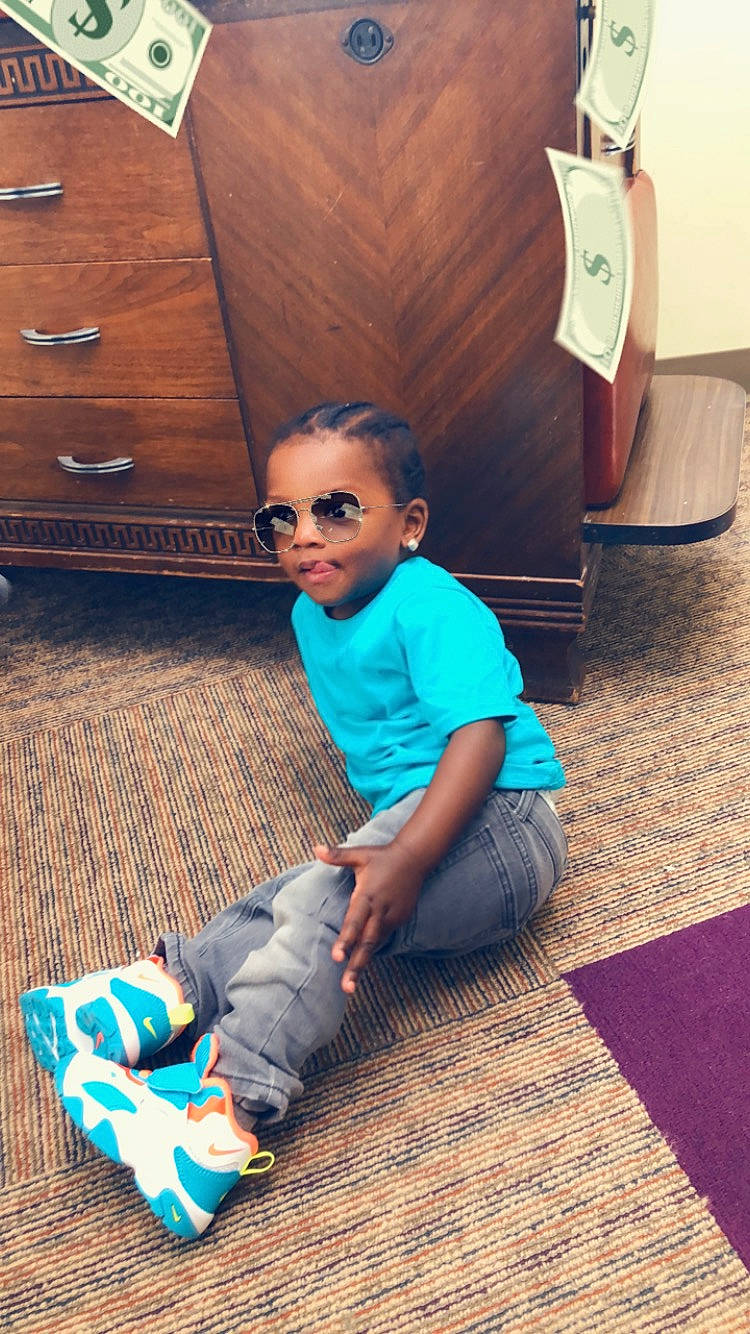 Brayden joined the competition — help win amazing prizes! carpet, child, cool, floor, flooring, glasses, hardwood, leg, leisure, person, play, shoe, sitting, toddler, vacation, wood, wood_flooring