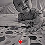 baby, bed, bedroom, blanket, child, cute, face, hand, happy, indoor, infant, monochrome, pattern, person, portrait, reaching, smiling, striped_clothing, toddler, young