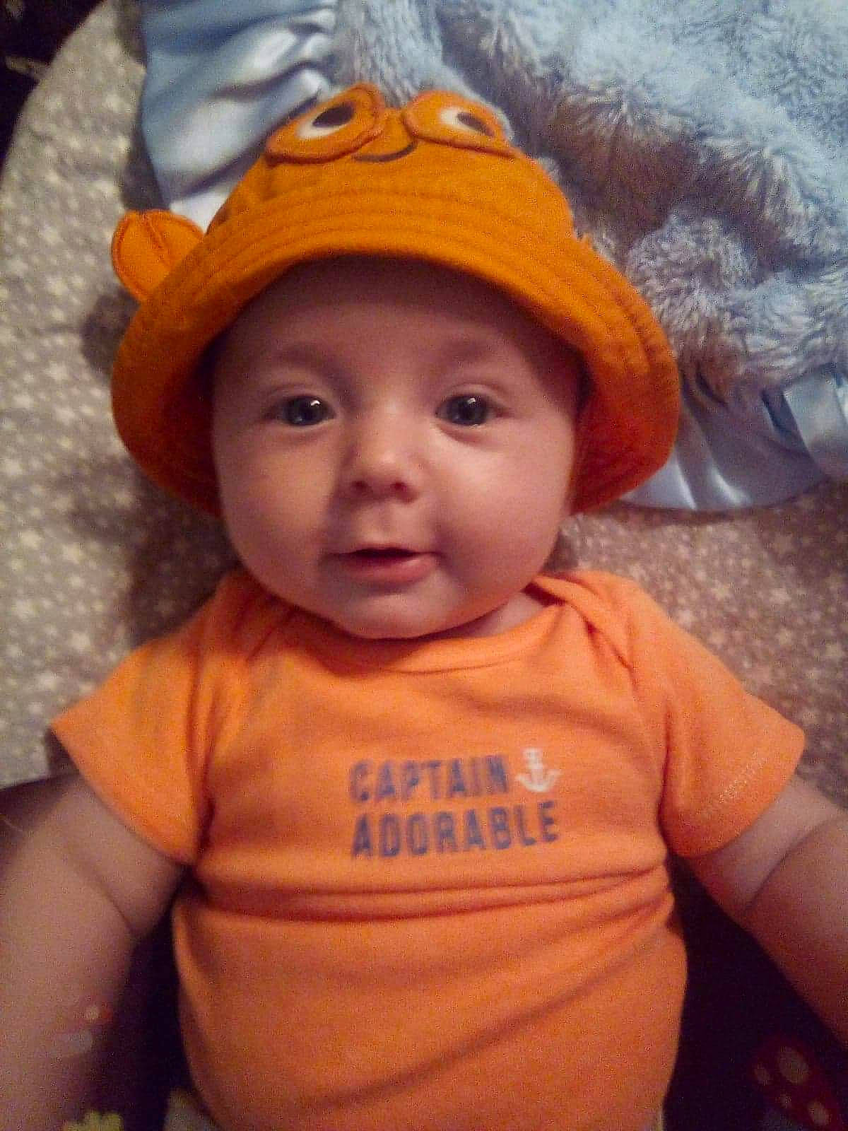 Bear is registered to the contest to win money with this photo: baby, cheek, child, hat, headgear, headwear, person, skin, smile, sun_hat, toddler