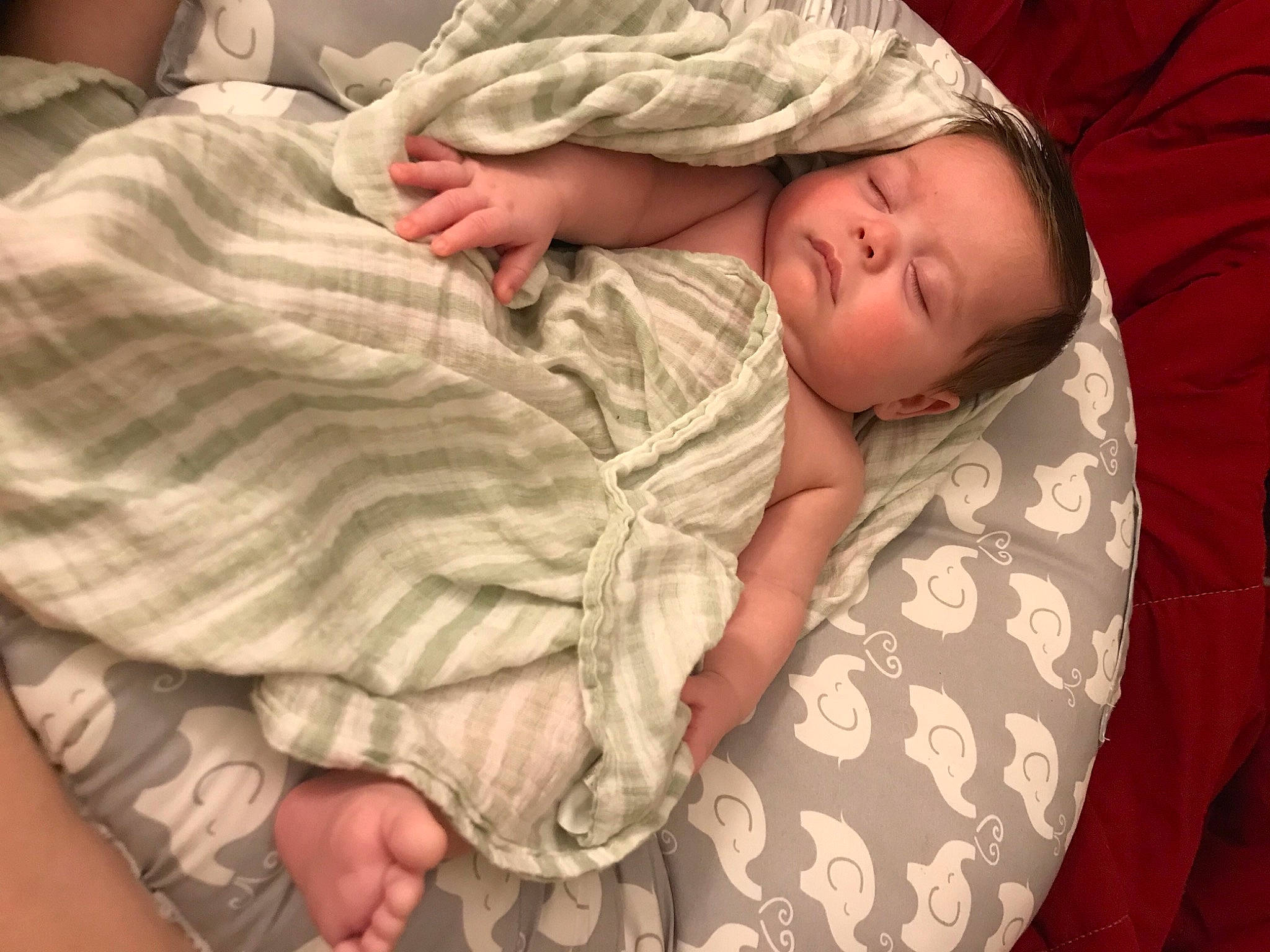Leighton is registered to the contest to win money with this photo: baby, baby_sleeping, baby_toddler_clothing, bedding, bedtime, cheek, child, comfort, finger, human_body, linens, nap, pattern, person, room, skin, sleeve, thumb, toddler, wood
