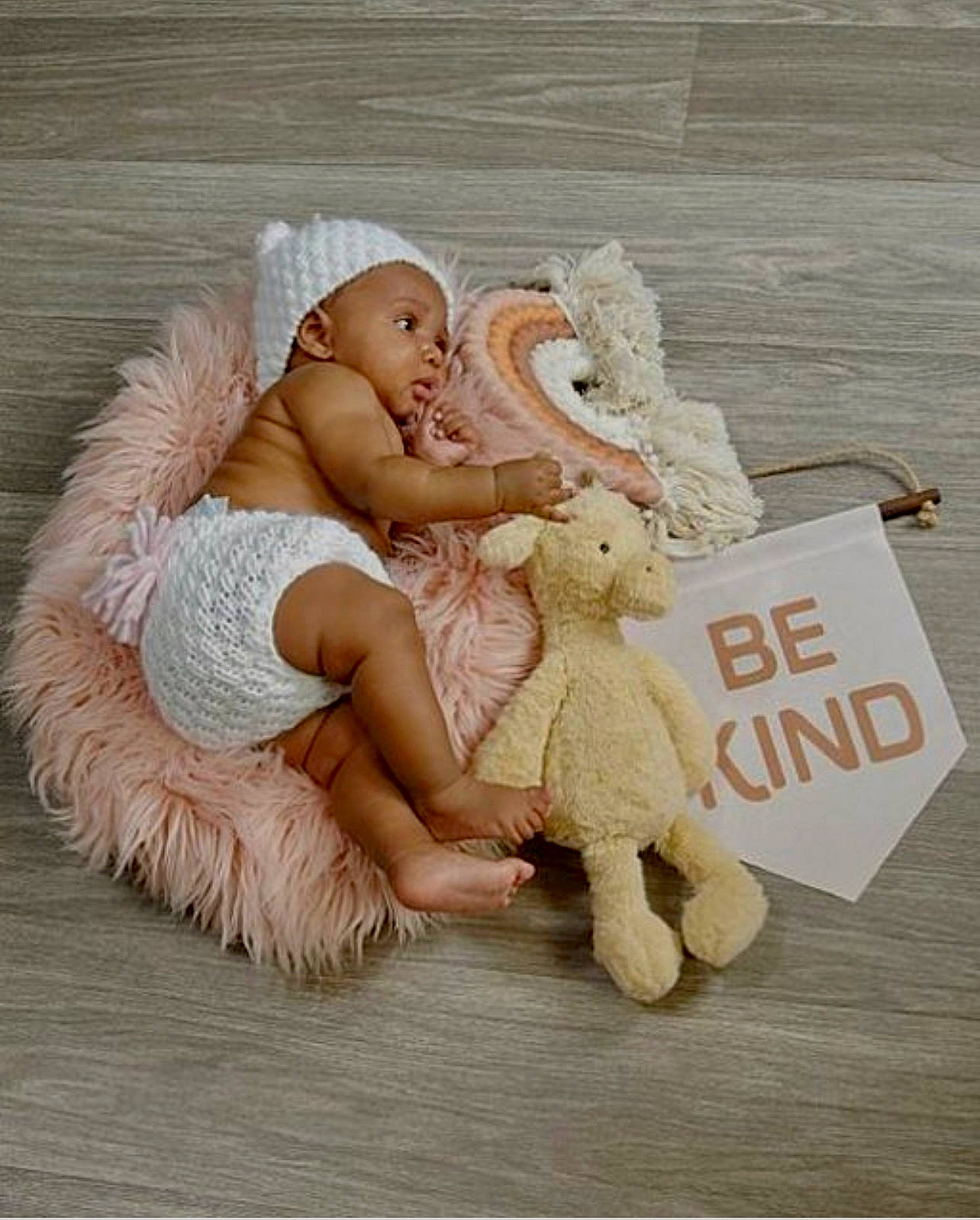 Amani is registered to the contest to win money with this photo: angel, baby, baby_sleeping, baby_toddler_clothing, comfort, doll, fawn, fictional_character, foot, happy, linens, mammal, person, plush, sitting, stuffed_toy, teddy_bear, textile, toy, vertebrate