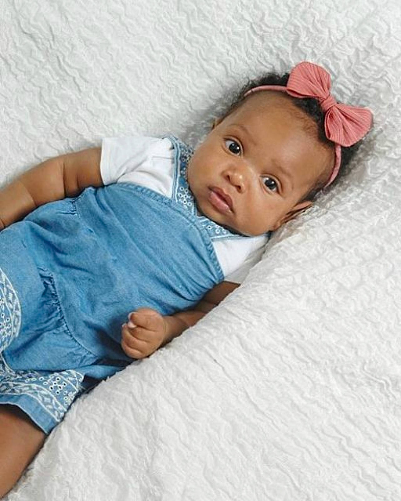 Amani is registered to the contest to win money with this photo: baby, baby_sleeping, baby_toddler_clothing, bedding, cheek, child, comfort, couch, elbow, eye, head, human_leg, iris, linens, lip, pattern, person, skin, sleeve, thigh