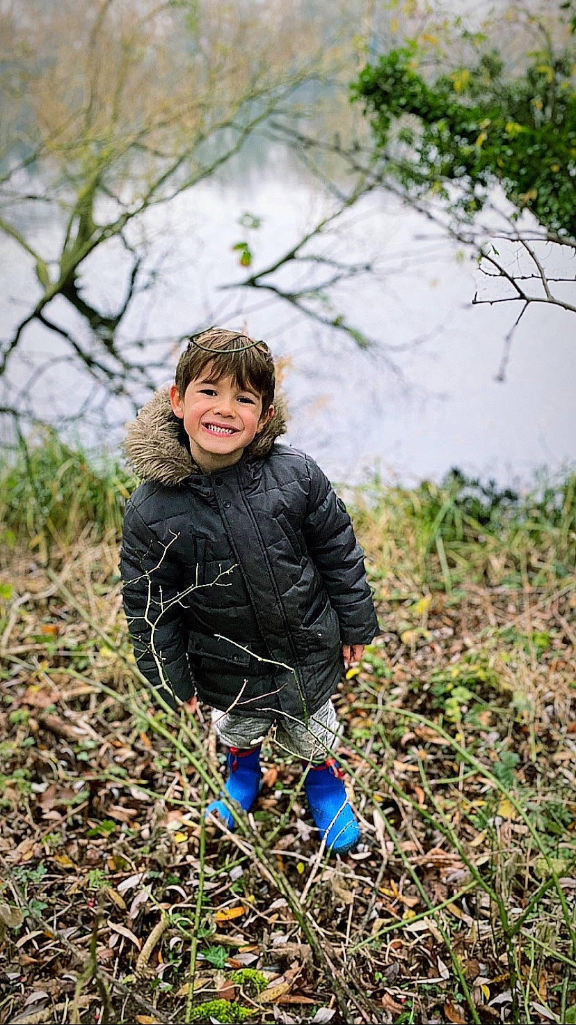 Spencer joined the competition — help win amazing prizes! branch, child, electric_blue, forest, grass, grass_family, grassland, happy, jacket, joy, leaf, people_in_nature, person, plant, prairie, sitting, smile, soil, toddler, tree