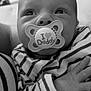 baby, infant, pacifier, striped_clothing, black_and_white, closeup, hand, face, cute, child, newborn, portrait, expression, eyes, person, soft, tender, love, family, holding