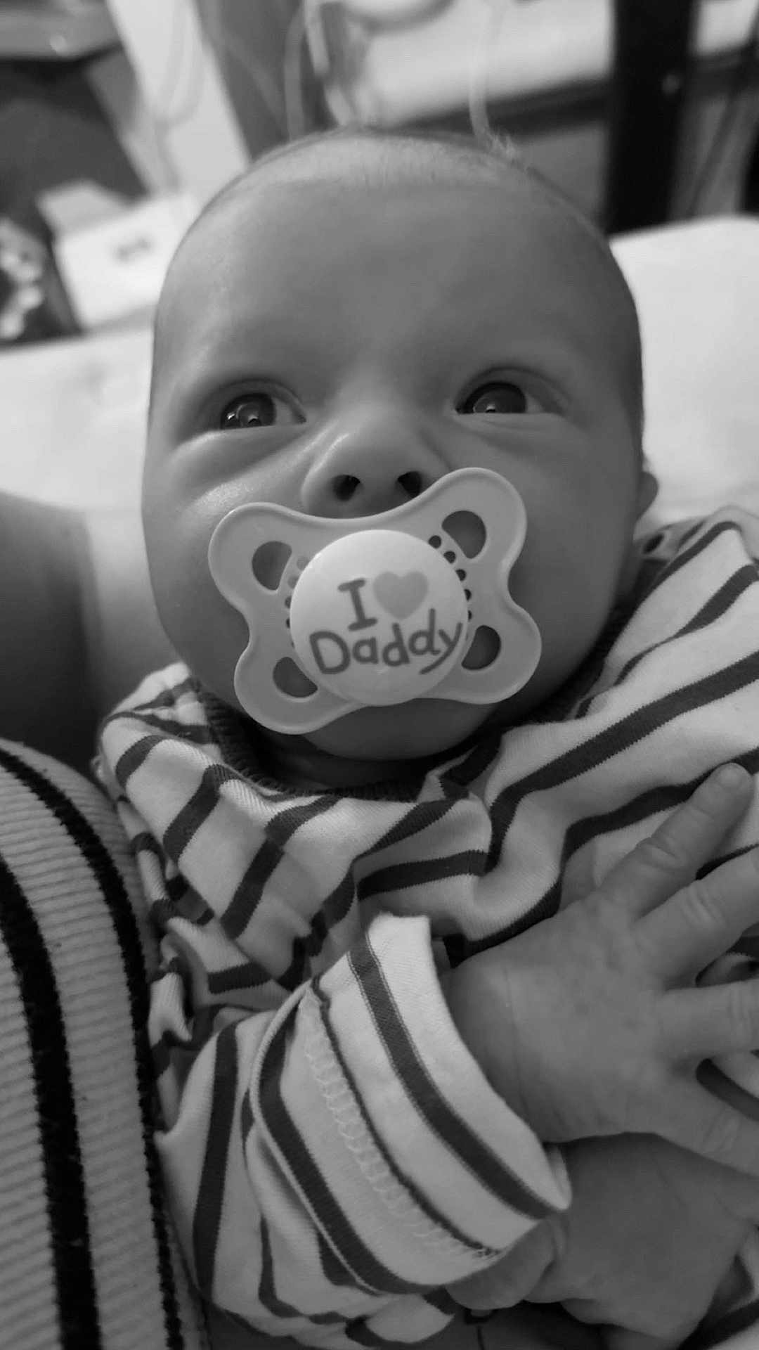 Oakley joined the competition — help win amazing prizes! baby, infant, pacifier, striped_clothing, black_and_white, closeup, hand, face, cute, child, newborn, portrait, expression, eyes, person, soft, tender, love, family, holding