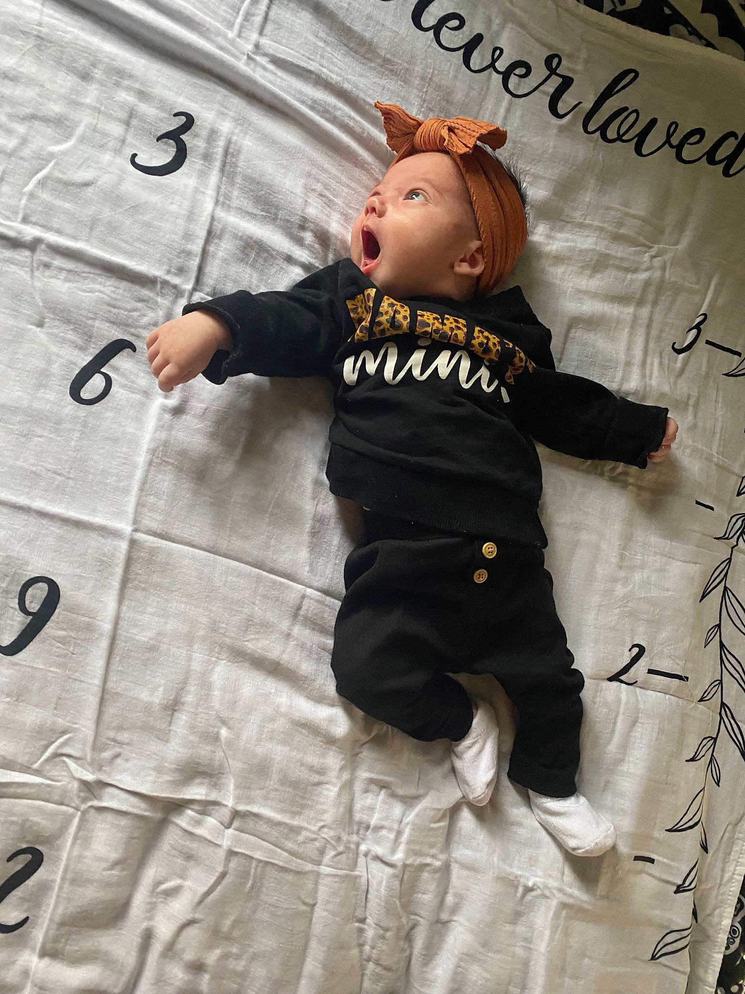 Avani joined the competition — help win amazing prizes! baby, baby_toddler_clothing, child, face, flooring, font, fun, gesture, happy, hat, linens, outerwear, pattern, person, sleeve, suit, t_shirt, textile, toddler, toy