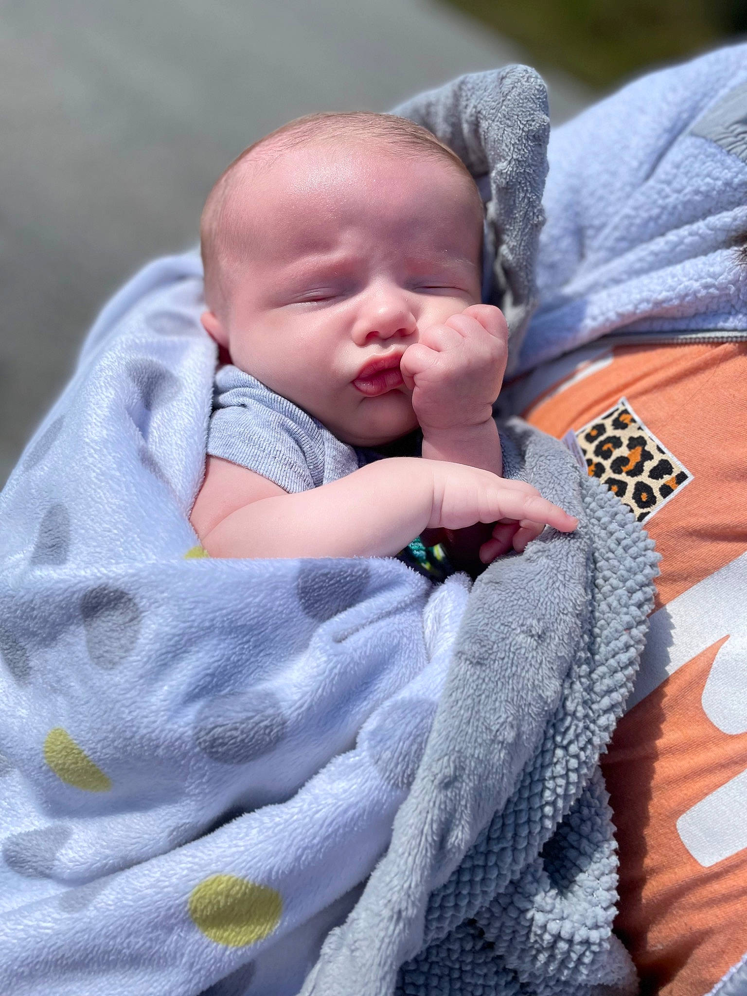 Braxtyn joined the competition — help win amazing prizes! baby, baby_products, baby_toddler_clothing, cheek, child, comfort, finger, gesture, grass, happy, linens, outerwear, pattern, person, sitting, skin, sleeve, textile, thumb, toddler