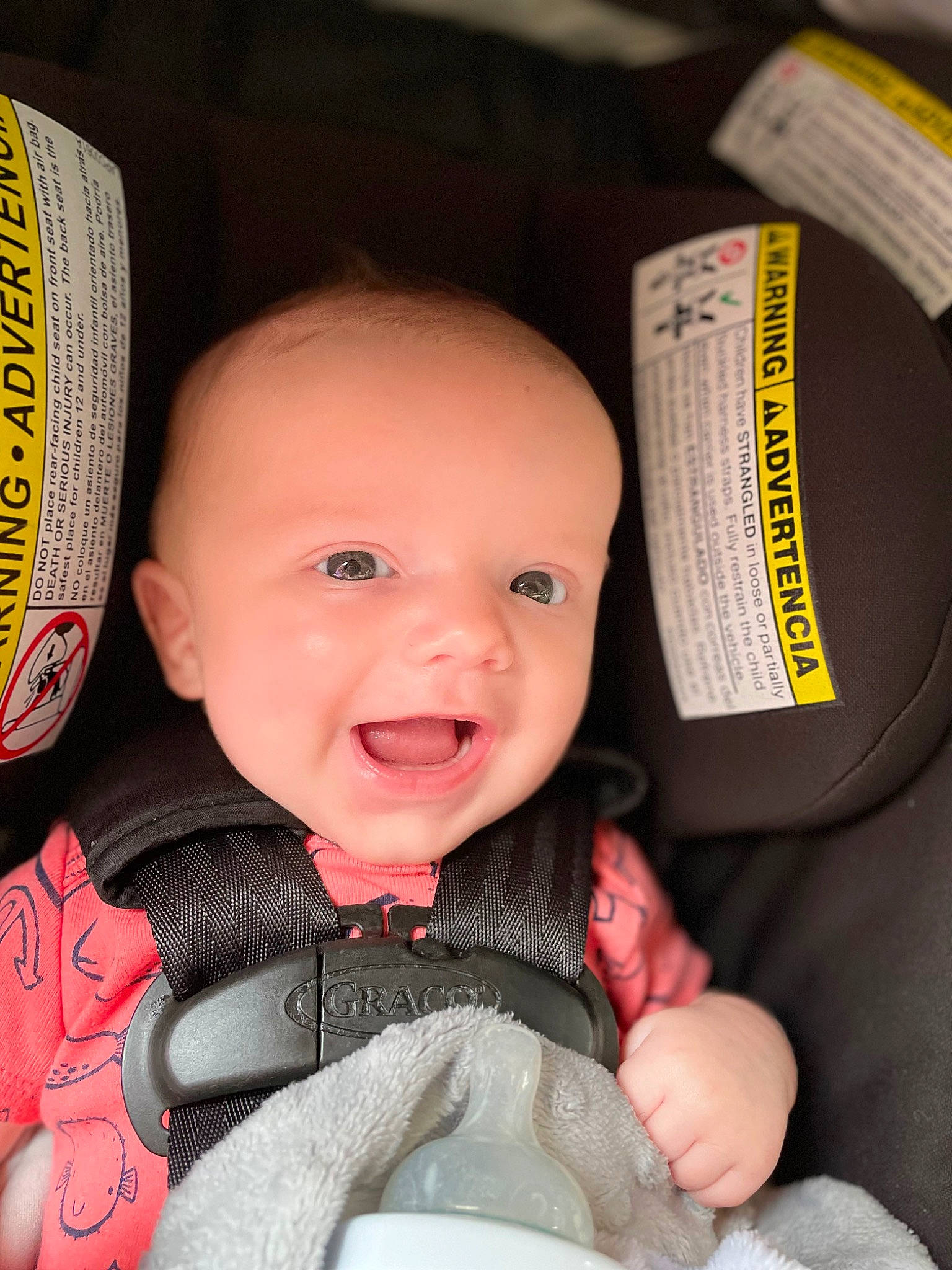 Braxtyn is registered to the contest to win money with this photo: baby, baby_carriage, baby_in_car_seat, baby_toddler_clothing, car_seat, cheek, comfort, finger, gesture, happy, head, human_body, iris, mouth, nail, nose, person, personal_protective_equipment, skin, smile