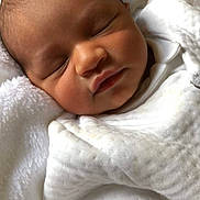 Aeden participe au concours pour gagner de l'argent avec cette photo : baby, sleeping, blanket, white_clothing, soft_texture, newborn, infant, peaceful, cozy, face, head, skin, portrait, closeup, resting, child, cute, human, indoors, comfort