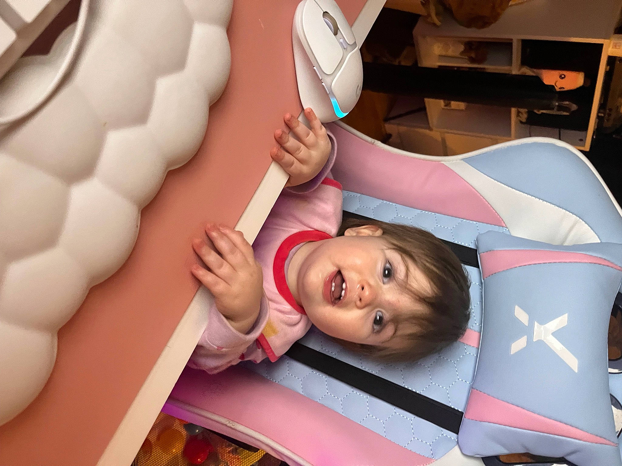 Lillie-mae is registered to the contest to win money with this photo: automotive_design, carmine, child, comfort, finger, fun, gesture, happy, human_body, human_leg, leisure, mouth, nail, person, pink, skin, smile, thigh, thumb, toddler