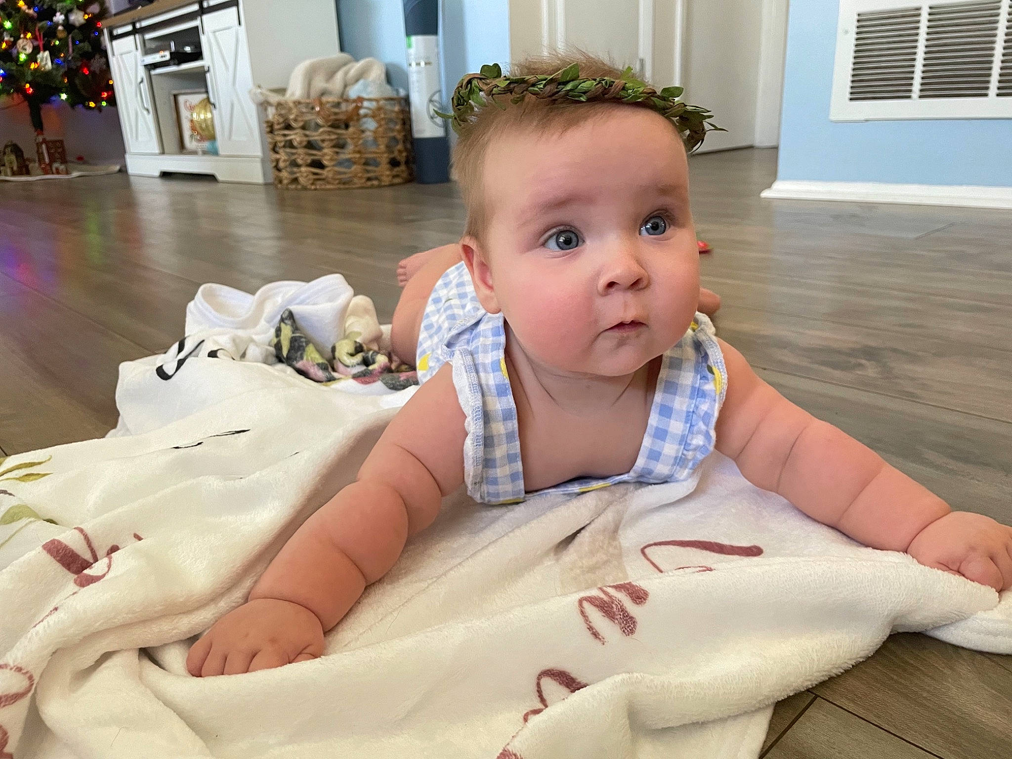 Scarlett joined the competition — help win amazing prizes! baby, baby_safety, baby_toddler_clothing, child, comfort, eye, floor, flooring, fun, happy, houseplant, linens, person, plant, sitting, skin, thumb, toddler, tummy_time, white