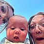 Elliott joined the competition — help win amazing prizes! baby, adult, glasses, face, expression, closeup, selfie, outdoor, blue_sky, bib, person, portrait, happy, family, skin, head, young_child, casual, daylight, nose_ring